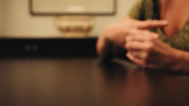 The woman removes the wedding ring from her finger. A feeling of love fading. Adultery and divorce concept. High quality 4k footage