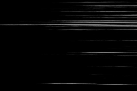 Screen display with white glitch scan lines on black abstract background