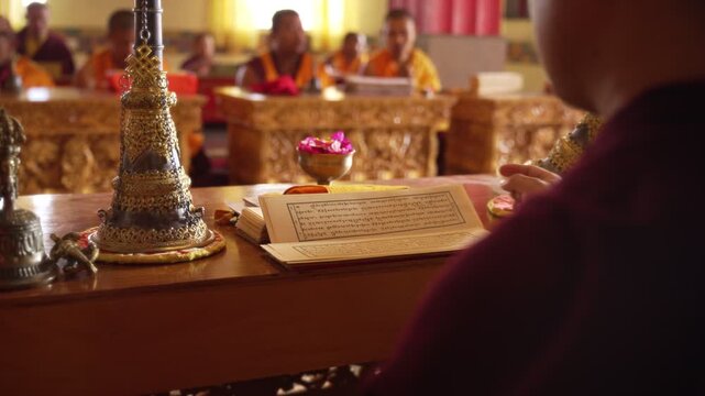Tibetan Buddhist Monks Chanting from Sacred Texts During Ritual Ceremony.