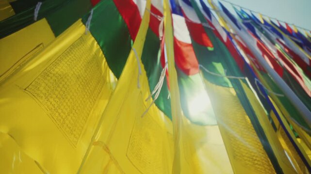 Sacred Tibetan Prayer Flags with Mantras Glowing in Morning Light