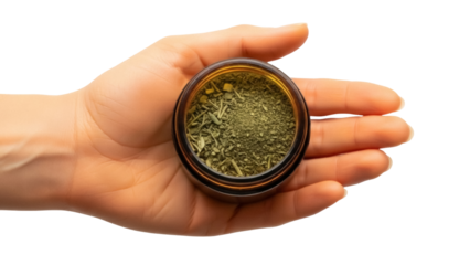 Isolated open jar of dried medicinal herb blend in human hand, herbalism, natural remedy