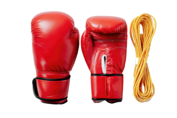 Boxer's Arsenal: A dynamic still life showcases the essence of boxing, featuring a pair of vibrant red boxing gloves and a coiled jump rope, capturing the spirit of fitness and combat.