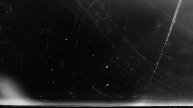 Dusty scratched scanned old film texture. Damaged grain. Overlay effect background image
