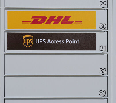 Germany, Paderborn, December 18. 2025, sign or lettering of DHL and UPS Access Point