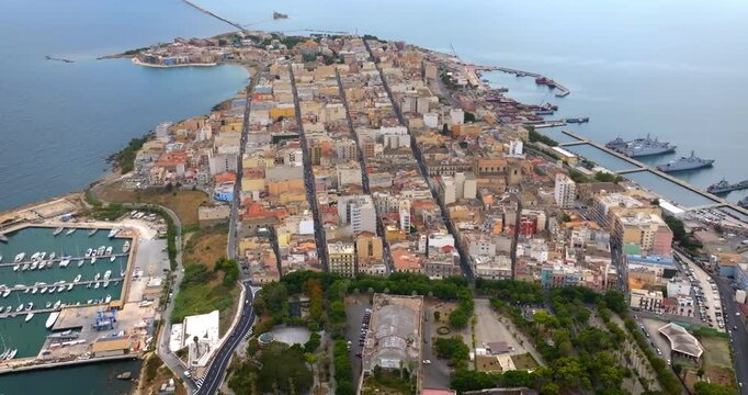 Aerial view of the town of Augusta, in the province of Syracuse, Sicily, Italy. The historic centre is built on an island overlooking the Mediterranean Sea. In the foreground is the Swabian castle.