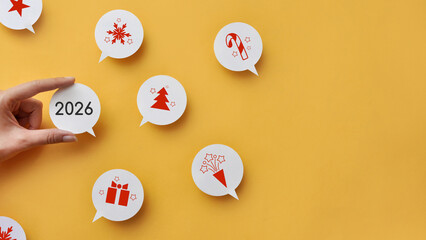 New Year 2026 greeting concept with speech bubbles and holiday icons on a yellow background