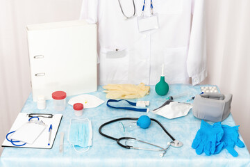 A collection of objects, medical equipment, instruments, supplies, and documents at a medical clinic