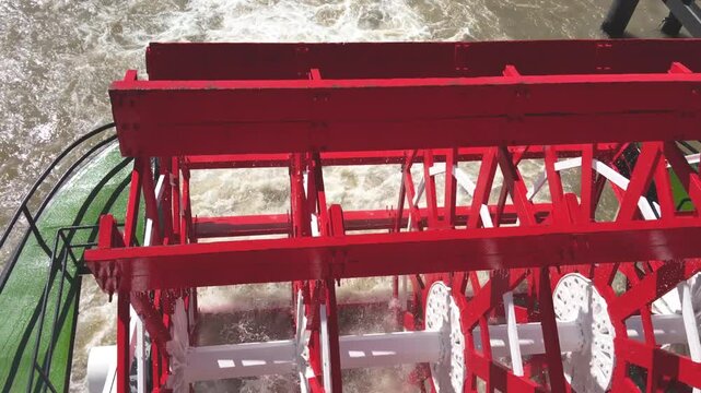 Historic Natchez steamboat paddle blades turning in motion along the Mississippi