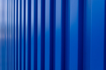 Fototapeta premium Blue shipping container backdrop,Blue building wall zinc backdrop,Blue shipping container wall. Seamless vertical metal panel texture with embossed ridges and industrial design.