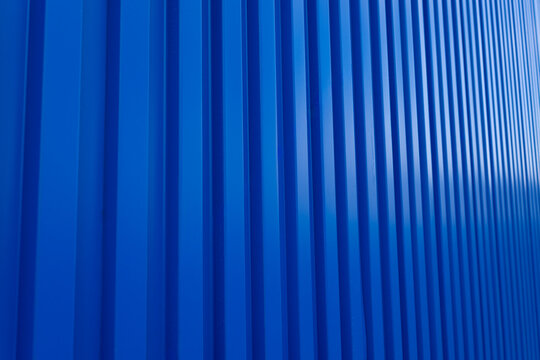 Blue shipping container backdrop,Blue building wall zinc backdrop,Blue shipping container wall. Seamless vertical metal panel texture with embossed ridges and industrial design.