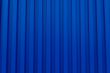 Blue shipping container backdrop,Blue building wall zinc backdrop,Blue shipping container wall. Seamless vertical metal panel texture with embossed ridges and industrial design.