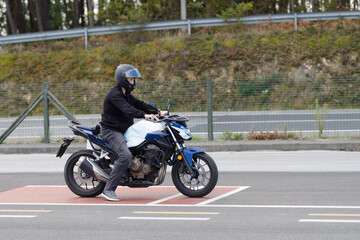 training in a motorcycle school, training in motorcycle control skills