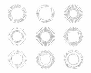 Nine circular graphic elements with radiating lines in a grid arrangement