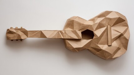 Geometric paper guitar sculpture on white surface musical instrument concept