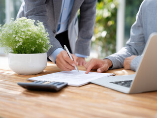 Client signs agreement in modern office setting during business meeting