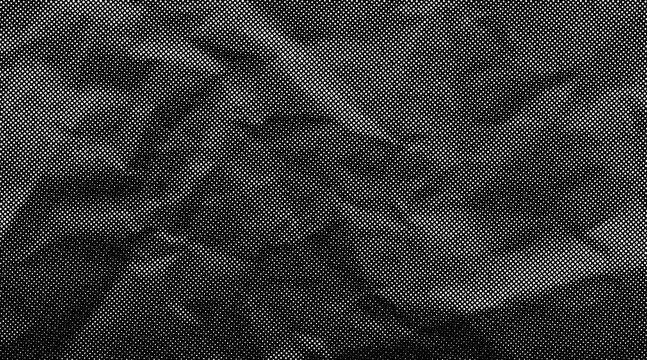 Halftone crumpled paper texture with wite a dotted, rough, and wrinkled surface. Black creased sheet background in comic pop-art style, featuring grainy folds and gritty distressed details.