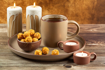 Cup of tea, candies and candles