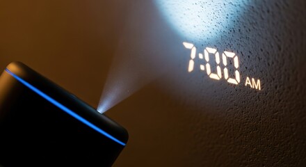 Digital alarm clock projecting 7:00 AM onto a textured wall.