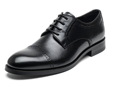 Sleek, shiny black leather dress shoe featuring brogue detailing on a white background, offering a sharp, formal look