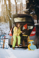 Mother and son relaxing in winter park