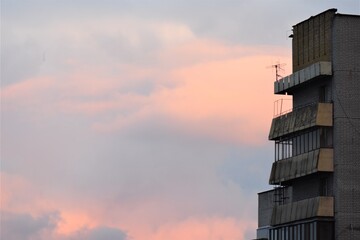 Modern building in the city at sunset, closeup of photo in a winter season