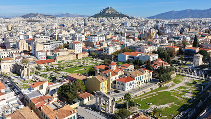 Obraz premium Aerial drone photo of iconic Roman Market featuring tower of Winds and Gate of Athena in the heart of Athens historic centre built in Plaka district, below Acropolis hill, Attica, Greece