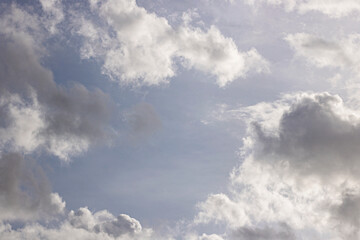 Fototapeta premium Bright and Grey Clouds in a Dynamic Sky. Clouds Sky Background. Nature and Climate Background. High quality photo
