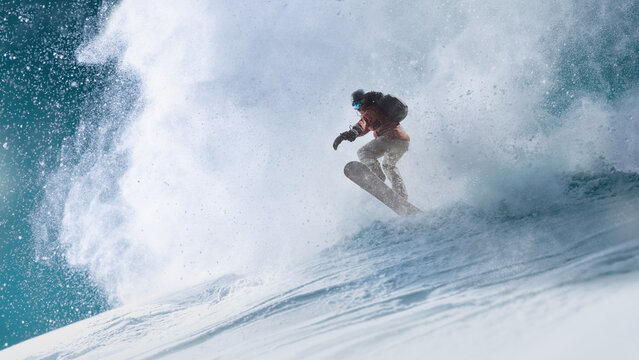 Action artwork. Powerful snowboarder jumping through deep snow on mountain slope. Concept of extreme sports marketing, outdoor lifestyle campaigns, performance fashion and winter event promotion.