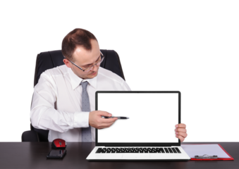 Businessman sits in the office and points a pen at a blank laptop screen