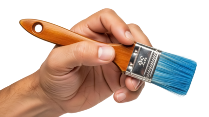 Isolated hand holding paint brush with blue bristles for art projects and home improvement