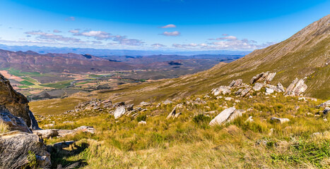 A panorama view down a steep valley on the Swartberg Pass in the Swartberg mountains in South Africa in springtime