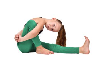 Girl in yoga pose wearing green leggings and black crop top