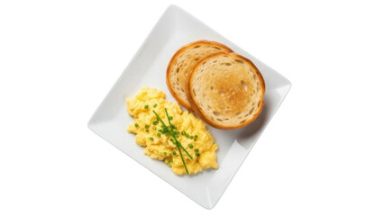 Isolated plate of scrambled eggs with chives and two slices of toast for breakfast meal