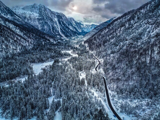 Winter magic in the Julian Alps. Lake Predil seen from above. Between snow and ice.