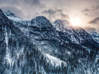 Winter magic in the Julian Alps. Lake Predil seen from above. Between snow and ice.