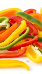 Freshly sliced bell peppers in vibrant colors offer a healthy, colorful addition to your next meal or a bold design element for your project