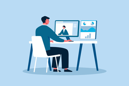 A man participates in a video conference while working at a desk