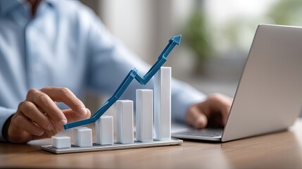 A person studies data trends displayed on a laptop, focusing on analytics and financial insights amid a dynamic work environment