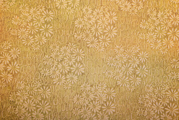 Old wallpaper on the wall. Old wallpaper for texture or background.