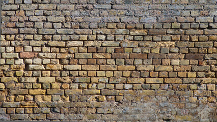 brown background, in the photo an old brick wall