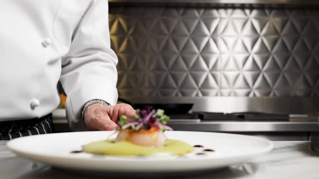 Expert hands carefully plating gourmet seafood dish with precision
