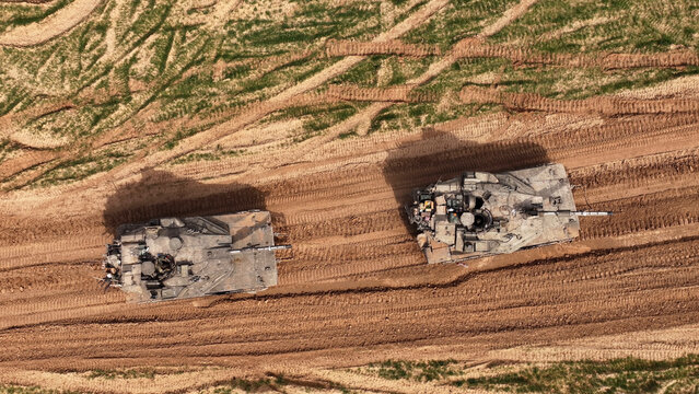 Aerial Top Down Merkava Tanks Gaza Border

Drone footage showing two IDF Merkava tanks from a top down aerial view near the Gaza border in 2024.
