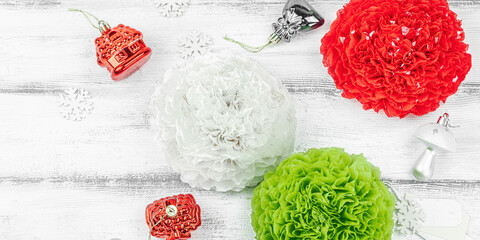 Traditional New Year composition. Festive decor, handmade paper flowers, gift idea. Holiday time