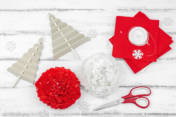 Traditional New Year composition. Festive decor, handmade paper flowers, gift idea. Holiday time