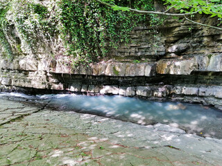 A river and waterfall in the Caucasus Mountains