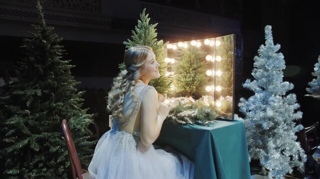 Elegant woman preparing for festive Christmas party. New Year's atmosphere.