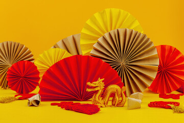 Happy Chinese New Year traditional concept. Oriental asian style paper fans on red background