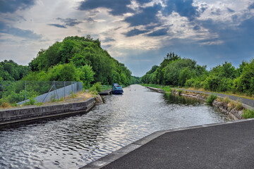 2023-06-18 A CANAL IN CAMELON SCOTLAND WITH A NICE REFLECTION AND LUSH GREENERY 