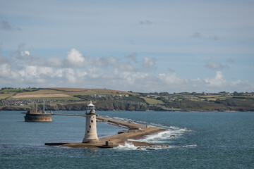 breakwater and lighthouse in Plymouth sound, England UK. granite tower beacon prominent national heritage landmark building in bay on English channel coastline.  