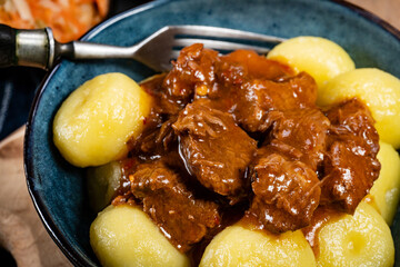 Beef stew in gravy, served with silesian dumplings.